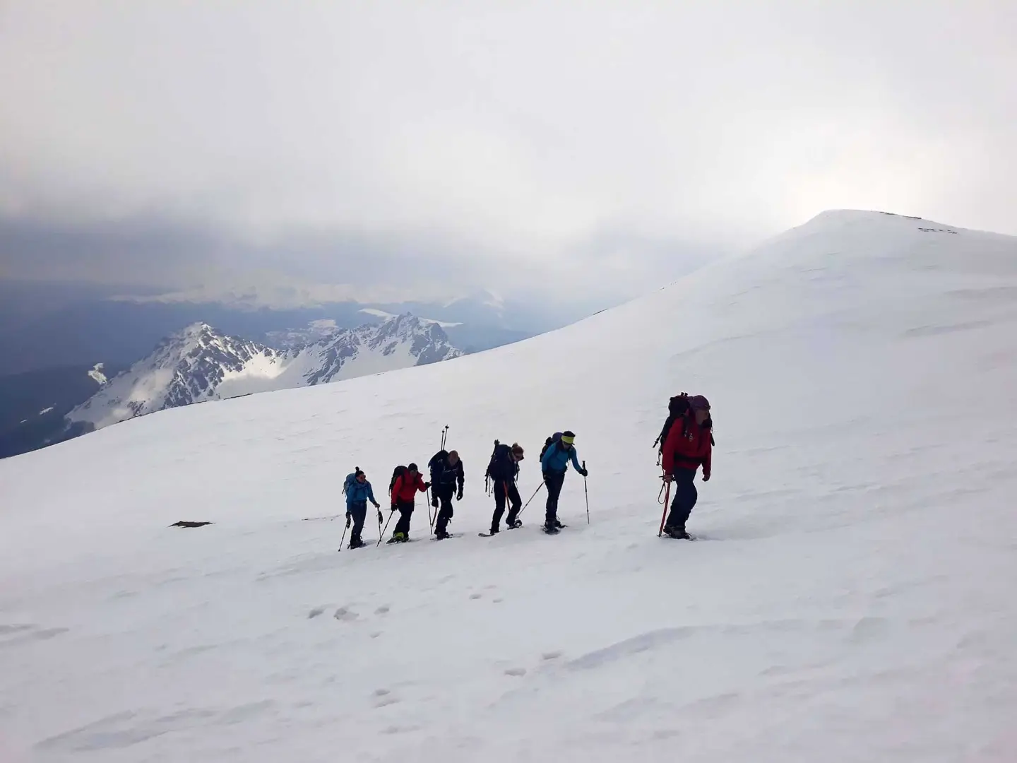 Hikers crossing a high mountain slope