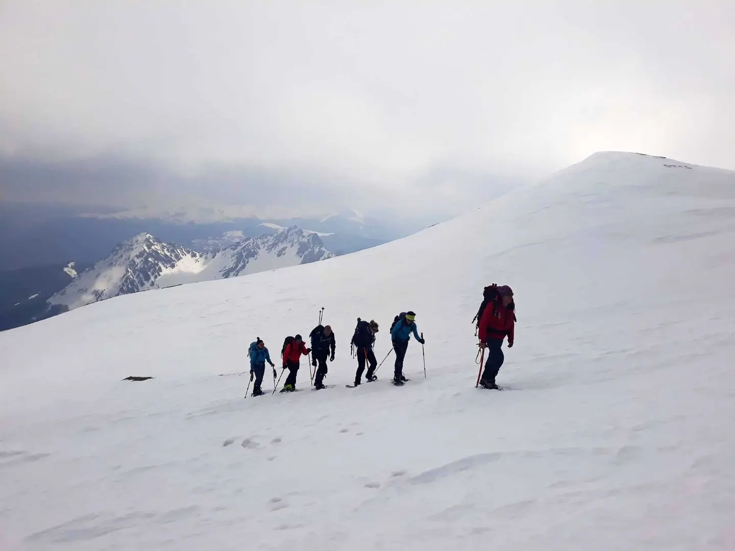 Hikers crossing a high mountain slope