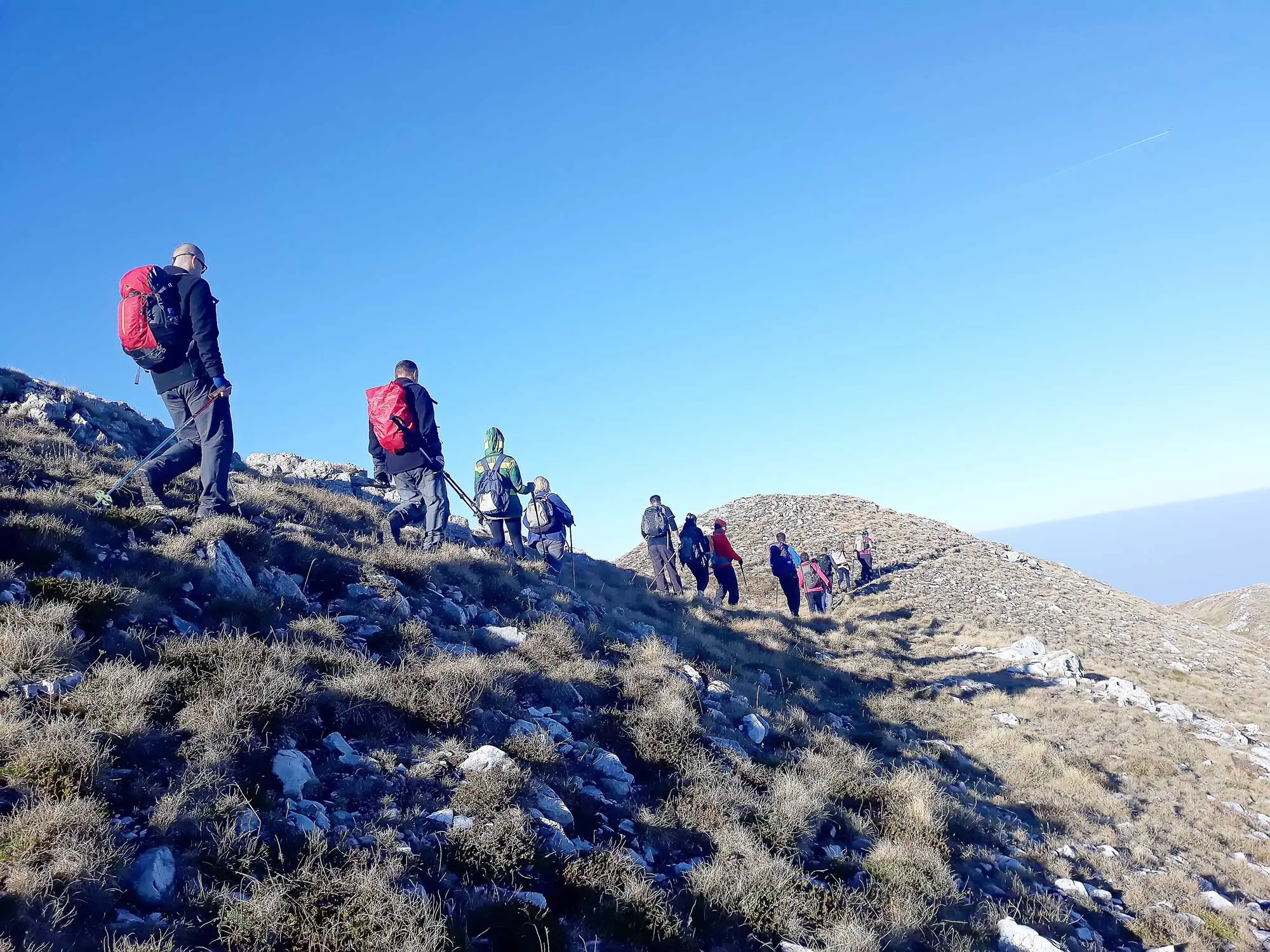 Hikers on a rocky mountain ridge