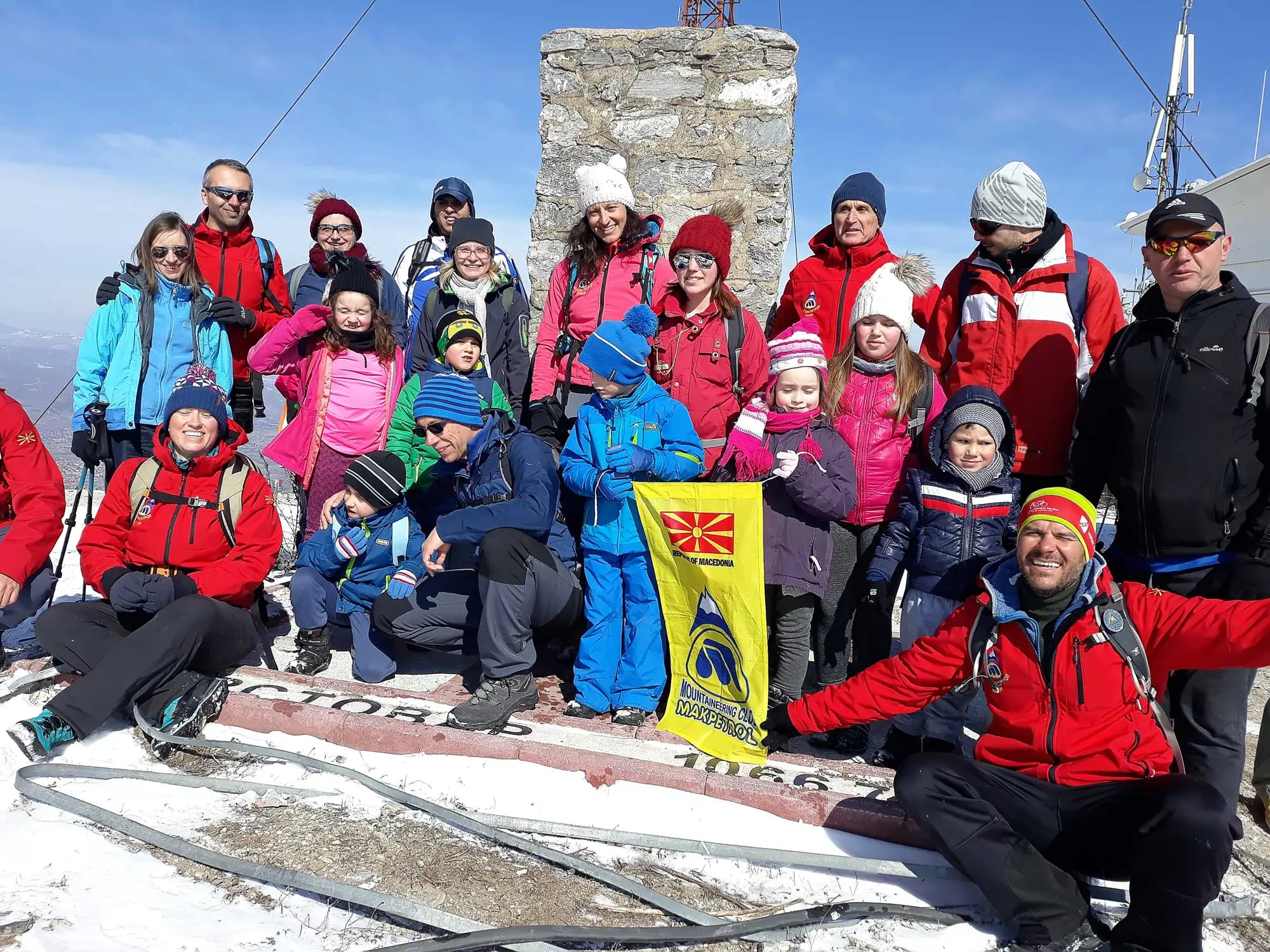 Hiking group celebrating on a summit