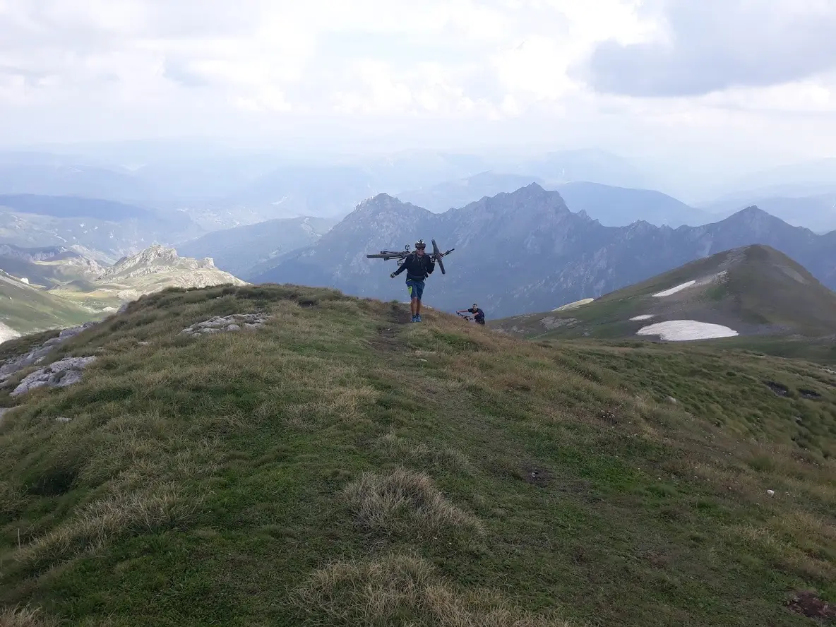Mountain biker on a summit ridge