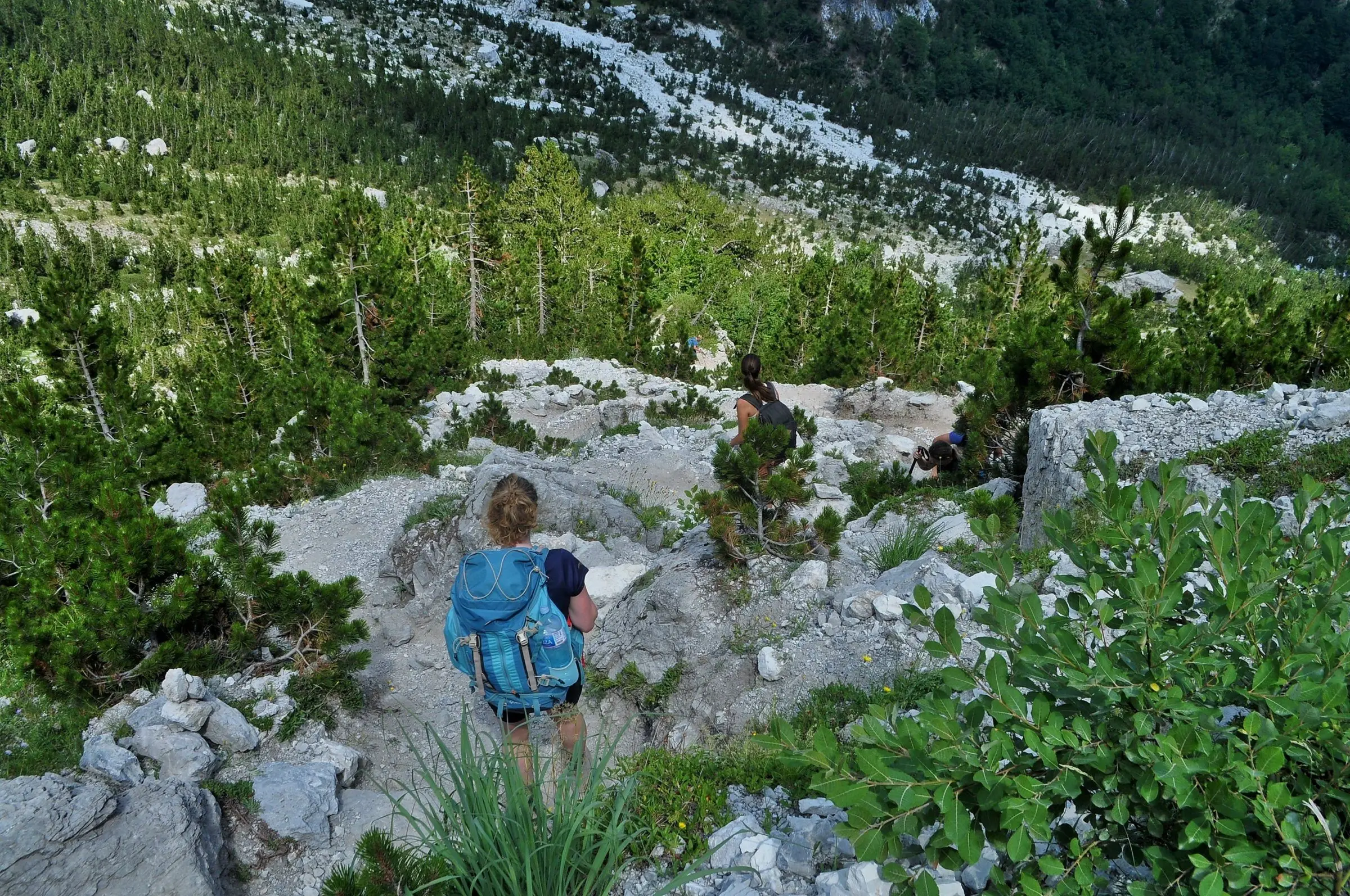 Hiker on the trail between Theth and Valbona