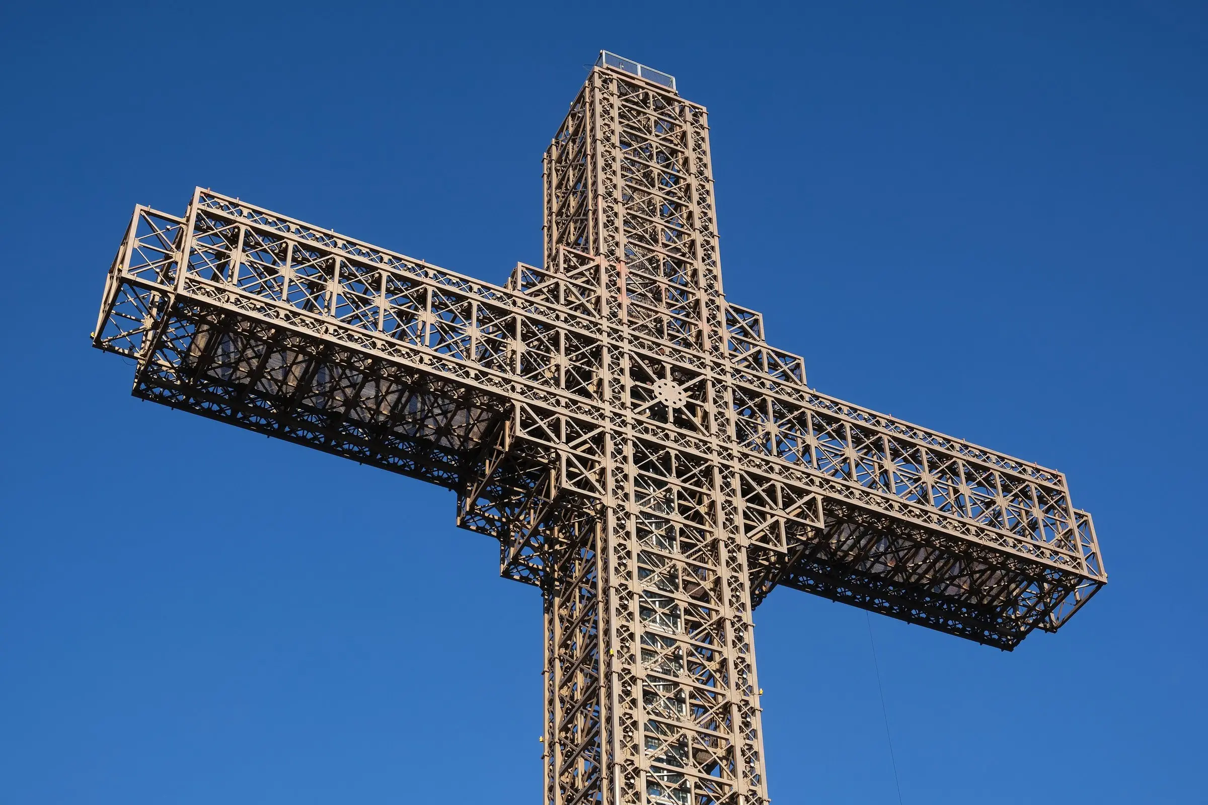 The steel frame of the Millennium Cross against a blue sky